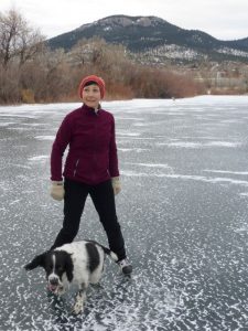 Dog hockey coach and referee, Mary Coster releases her dog from the penalty box after a two-minute biting penalty.
